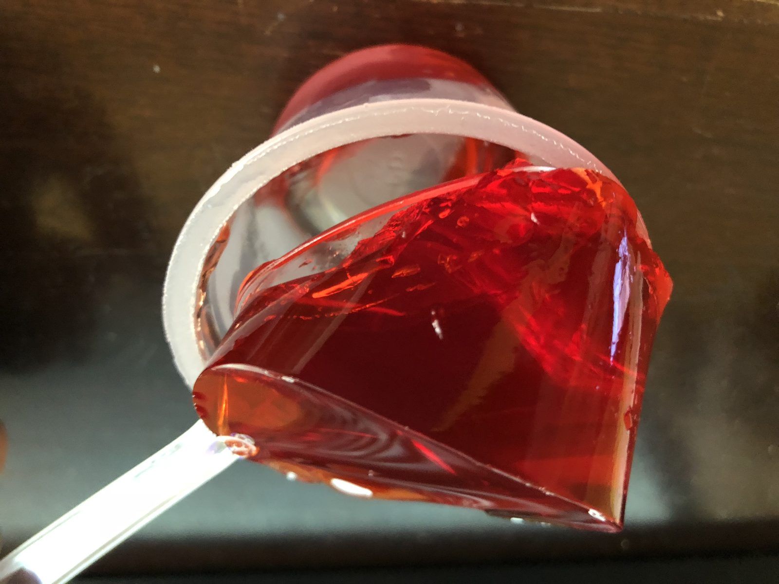 2019-10-10 22 15 43 Gelatin from a single opened cup of Jell-O strawberry gelatin snack being lifted by a spoon in the Franklin Farm section of Oak Hill, Fairfax County, Virginia
